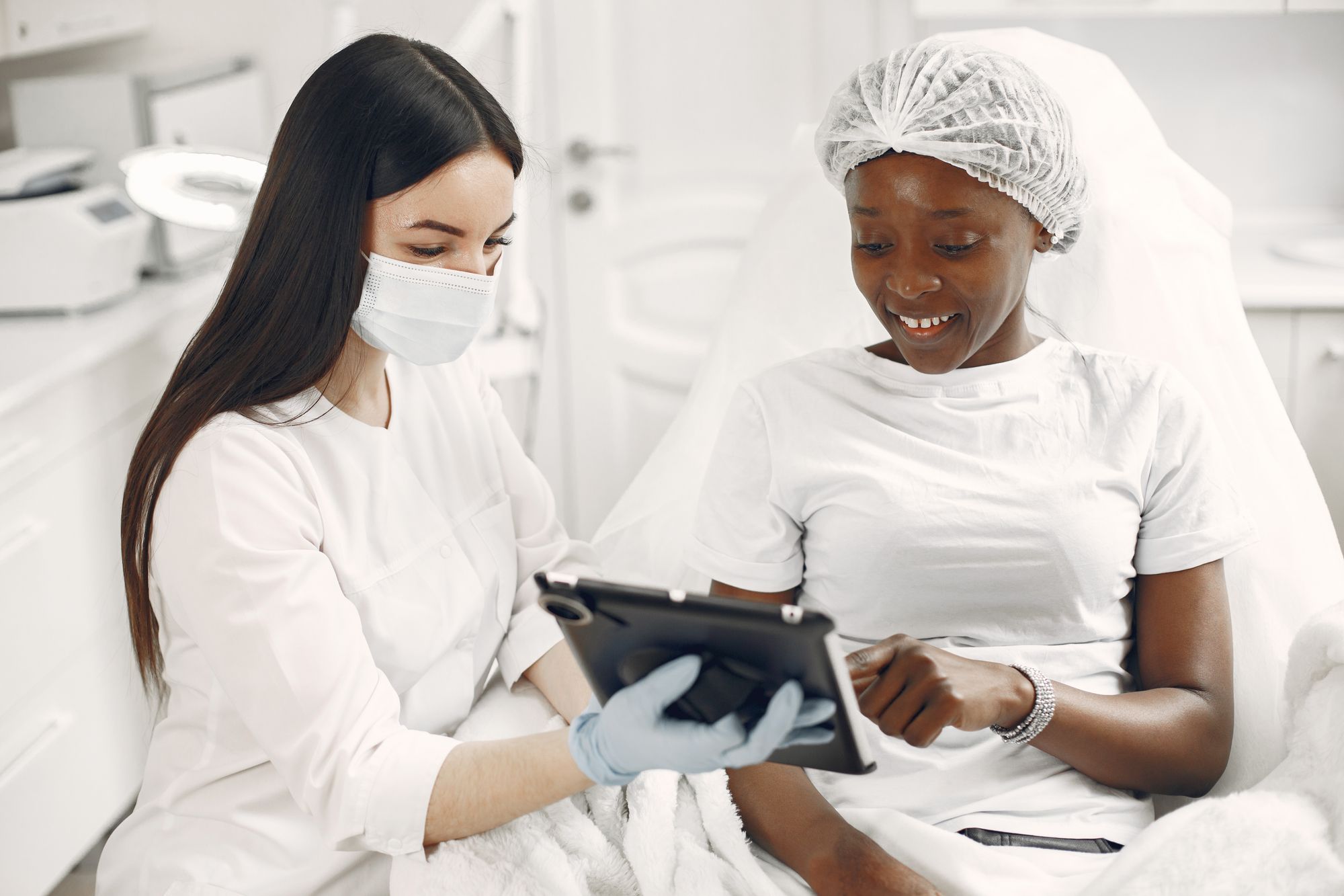 A practitioner and client discussing skincare
