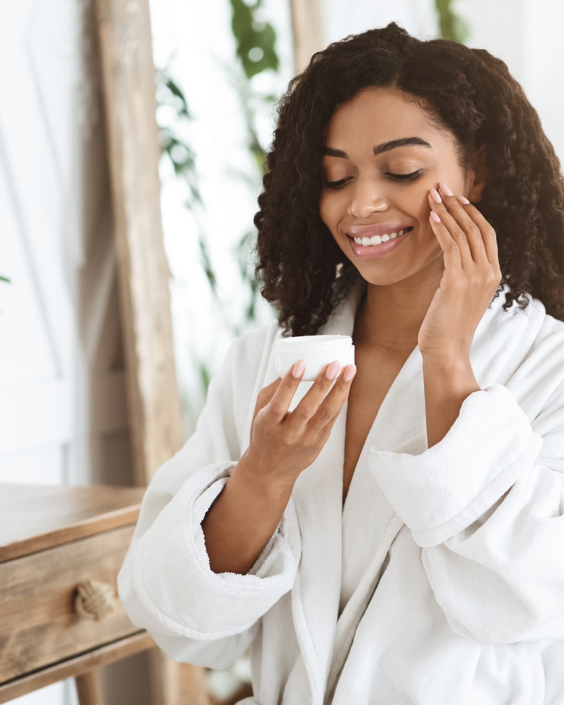 A woman trying a skincare cream